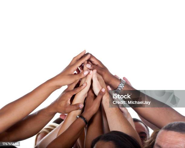 Multiethnic Team Celebrating Stock Photo - Download Image Now - Hand Raised, White Background, Unity