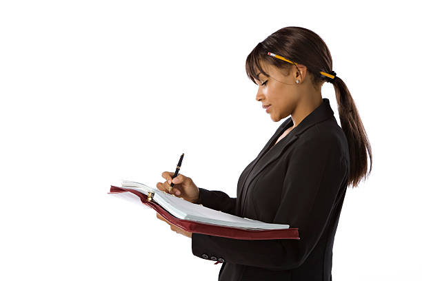 istock Professional Black Businesswoman Writing in Notebook 176767162