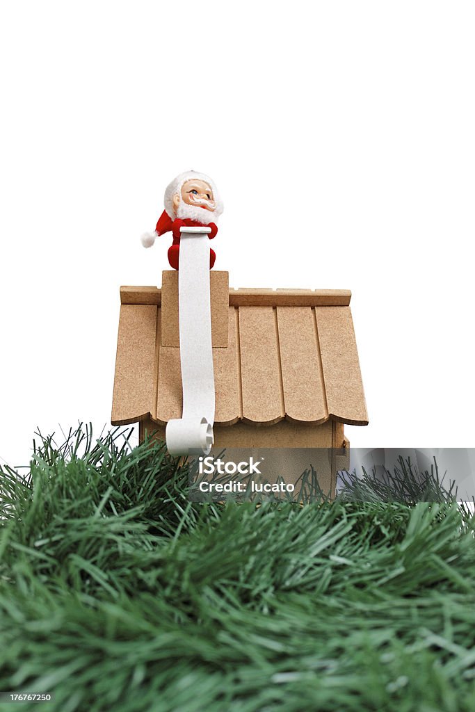 Santa e l'enorme lista dei desideri - Foto stock royalty-free di Casa