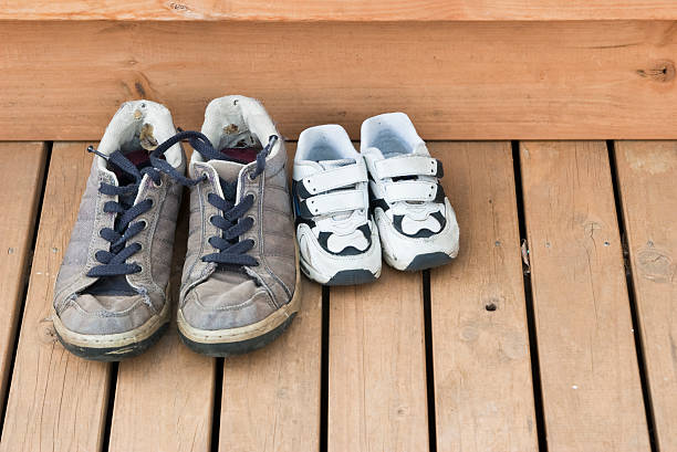 istock Big and small shoes on the back deck 176767712