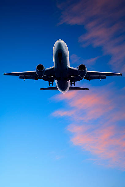 istock Jet Aeroplane Landing From Twilight Blue Red Sky Vertiical 176767813