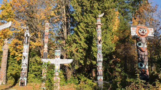 First Nations Totem Poles in Stanley Park during the fall in Vancouver