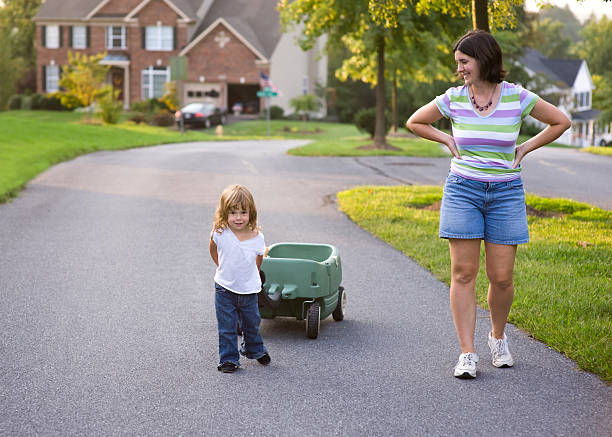 istock Mother and Daughter out for an Evening Walk 176769479