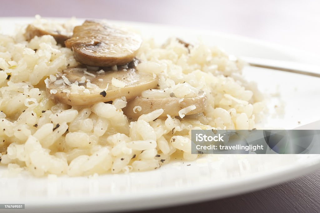 Mushroom Risotto Creamy mushroom risotto sprinkled with black pepper and parmesan. Close-up Stock Photo