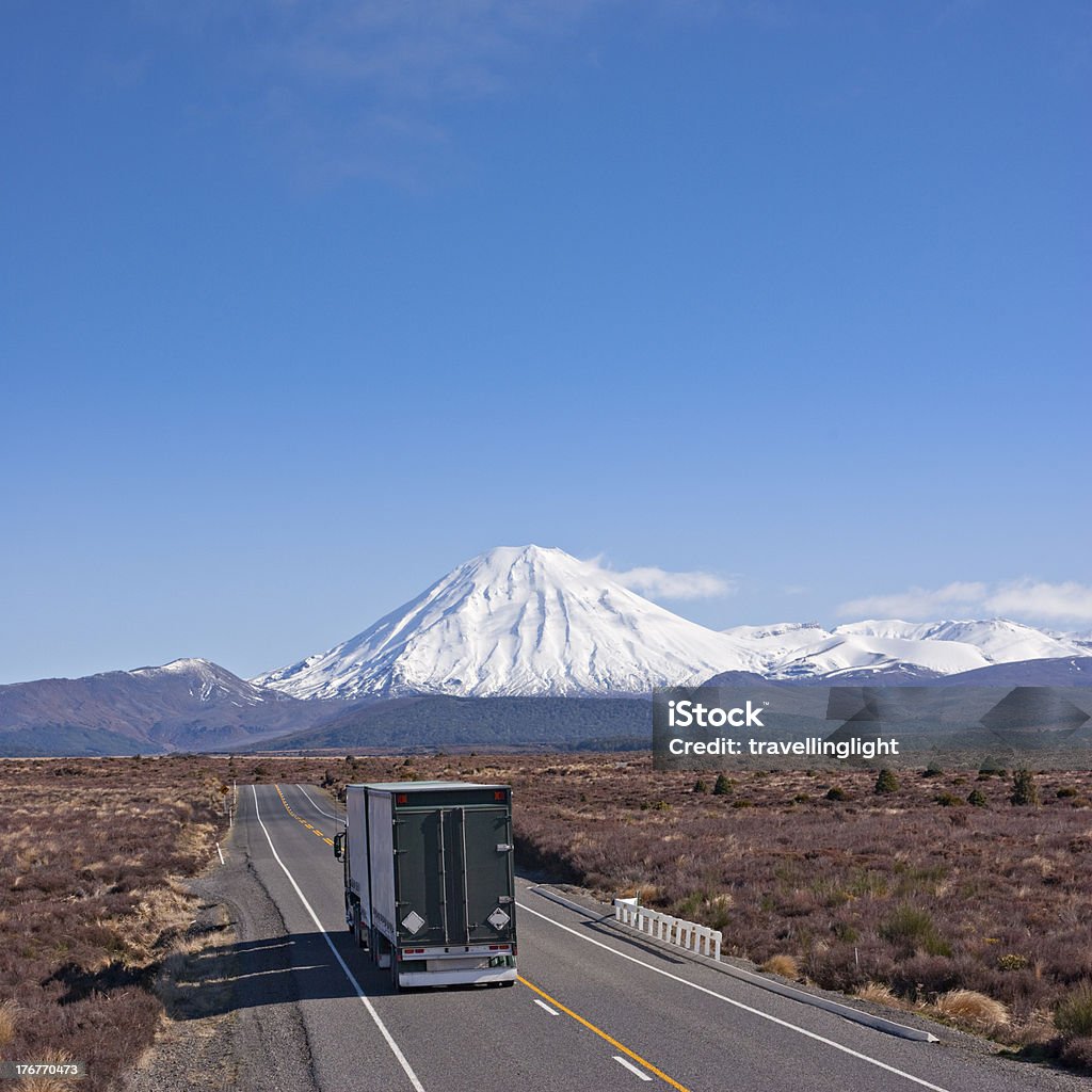 Truck on the Desert Road, New Zealand with Mount Ngauruhoe "A heavy truck and trailer on the Desert Road in the Central North Island of New Zealand, approaching Mount Ngauruhoe. More New Zealand:-" New Zealand Stock Photo