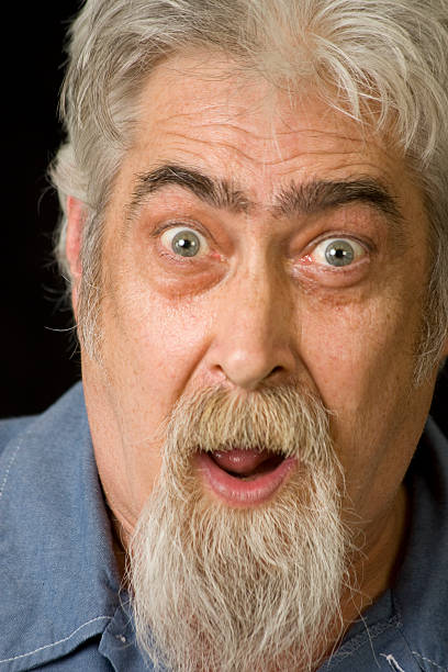 istock Middle Aged Man with Beard Looks Surprised 176772338