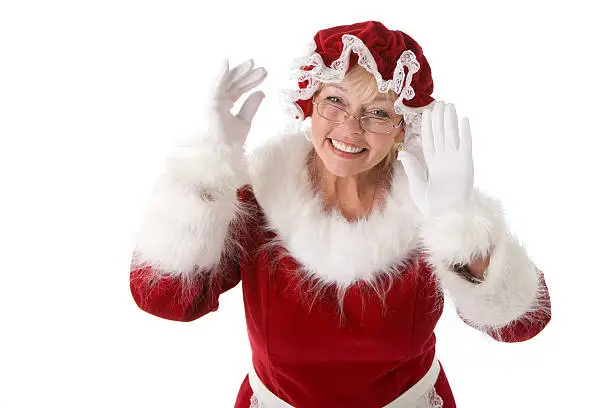 "Mrs. Santa Clause smiles and happily holds her hands up as if to welcome guests at Christmas.For similar images, please click on the lightboxes below."