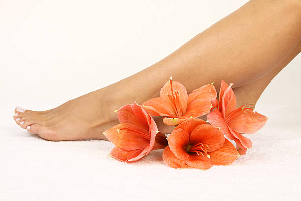 istock Pedicured feet  with beautiful flowers 176772829