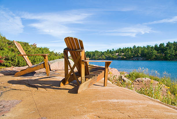 istock Muskoka/Adirondack Chairs by the Lake 176773084