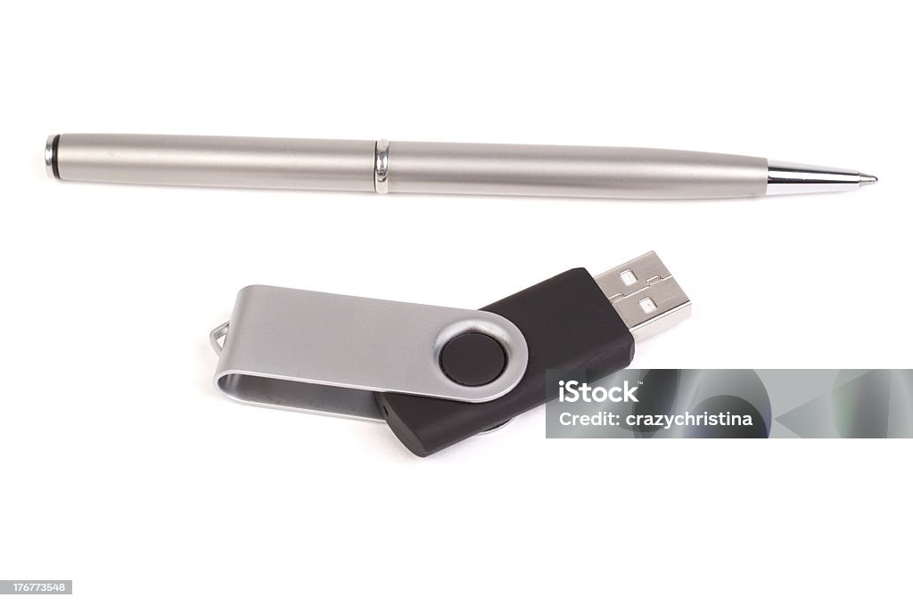 Pen and USB storage device Gray pen and a USB external storage device for computers Computer Stock Photo