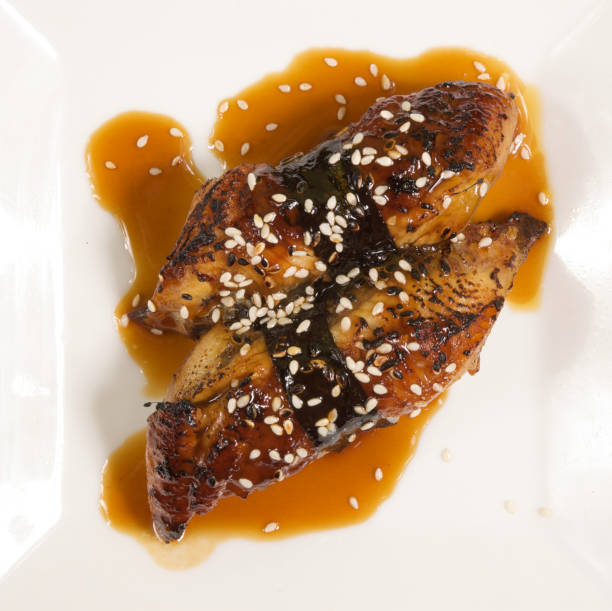 istock Two pieces of unagi on a white plate 176773864