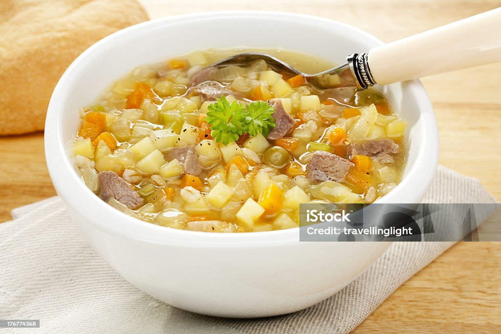 Vegetable Soup Scotch Broth "A bowl of bubbling hot Scotch Broth or Vegetable Soup, made from lamb shank, potato,carrot,celery,dried peas and pearl barley. More soup:-" Bowl Stock Photo