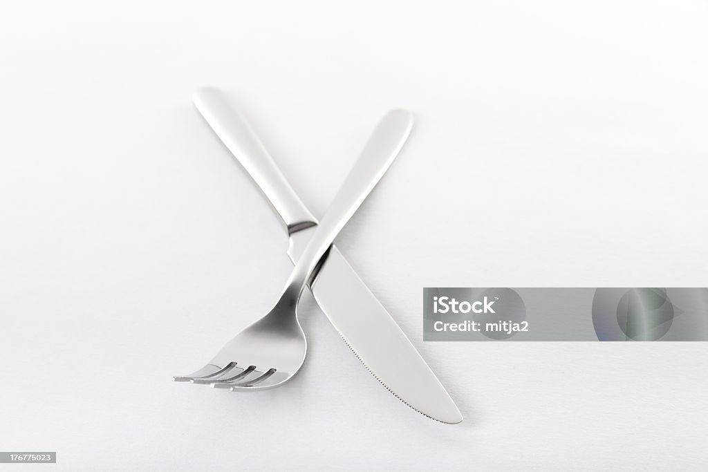 Incrociate forchetta e coltello. - Foto stock royalty-free di A forma di croce