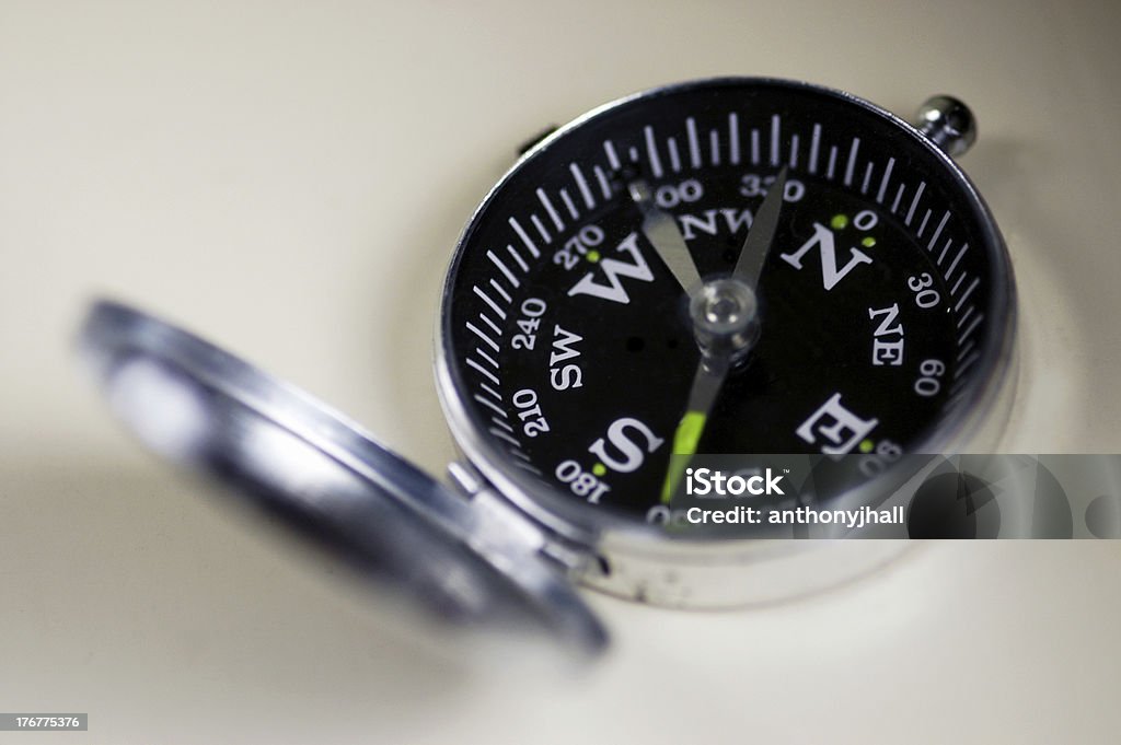 Traditional compass An old metal pocket compass with it's lid open Angle Stock Photo