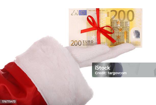 Geld In Der Hand Von Santa Claus Stockfoto und mehr Bilder von Ausverkauf - Ausverkauf, Band, Bezahlen