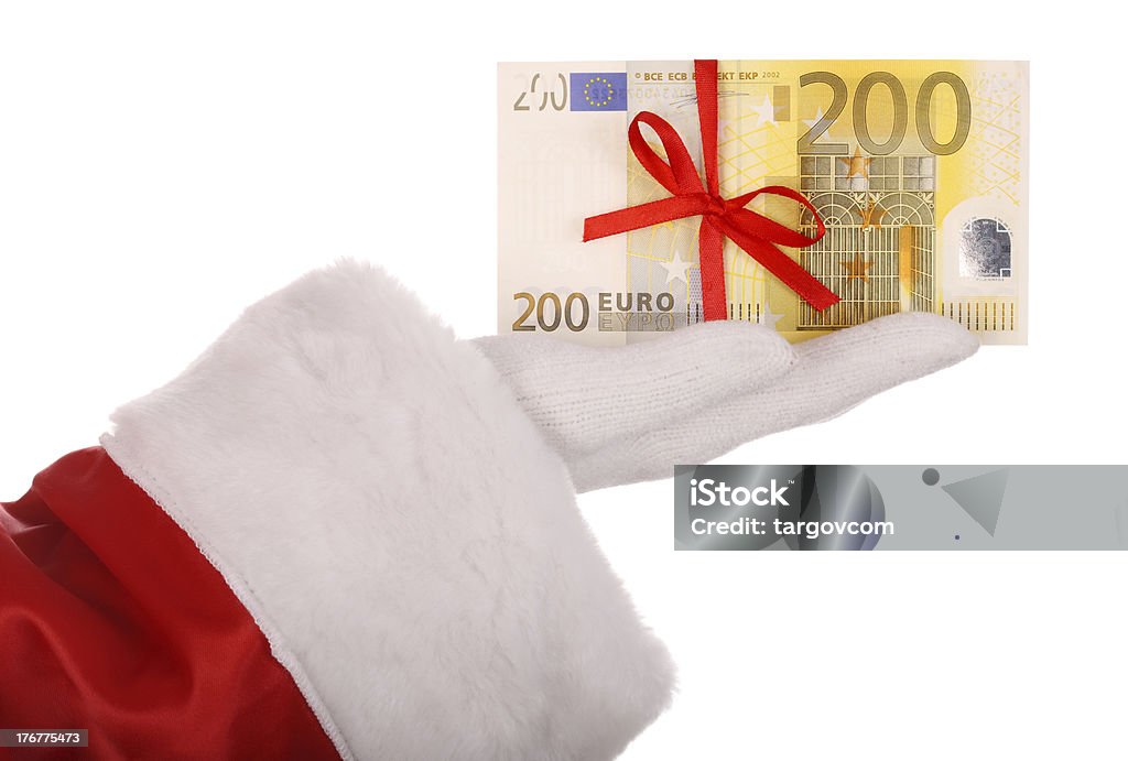 Dinheiro na mão do Pai Natal. - Royalty-free Branco Foto de stock