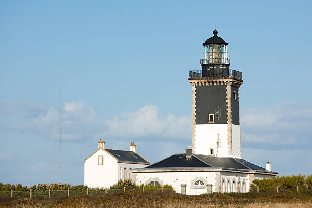 istock lighthouse and guardian house 176775599