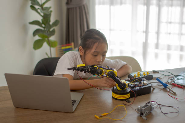 istock Young girl working on a robot design 1767762290