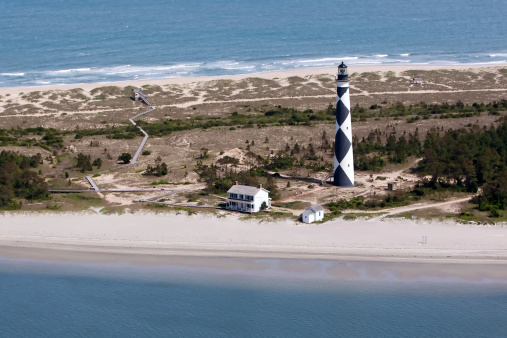 The Cape Lookout Lighthouse is a 163-foot high lighthouse located on the Southern Outer Banks of North Carolina. It flashes every 15 seconds and is visible at least 12 miles out to sea and up to 19 miles. The Cape Lookout Light is one of the very few lighthouses that operate during the day. It became fully automated in 1950.