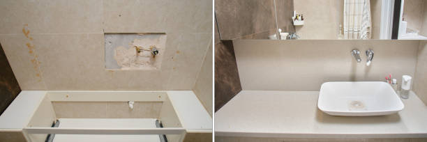istock The interior of the bathroom was completely transformed after the construction work, with a new cabinet and a contemporary mirror above the sink, before after. 1767769046