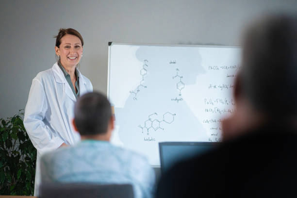 istock Female teacher teaching nontraditional students at university. Back to school. Pharmacy class. 1767770675