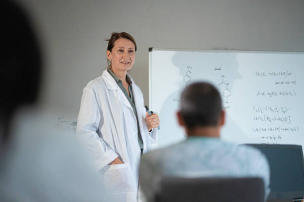 istock Female teacher teaching nontraditional students at university. Back to school. Pharmacy class. 1767770788