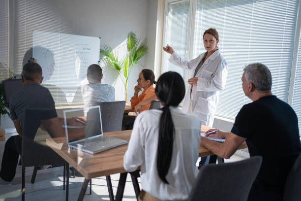 istock Female teacher teaching nontraditional students at university. Back to school. Pharmacy class. 1767771226