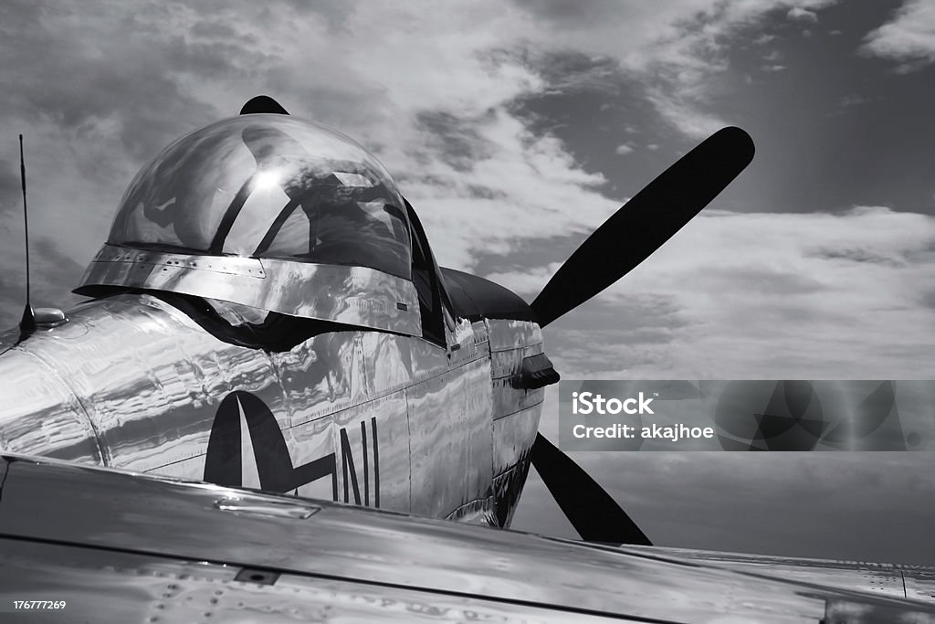 Vintage Mustang P51 airplane WWII - B&W "old war bird, p51, mustang airplane with cloudy skys black and white" Airplane Stock Photo