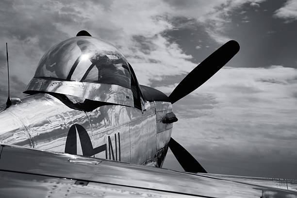 Vintage Mustang P51 airplane WWII - B&W "old war bird, p51, mustang airplane with cloudy skys black and white" p51 mustang stock pictures, royalty-free photos & images