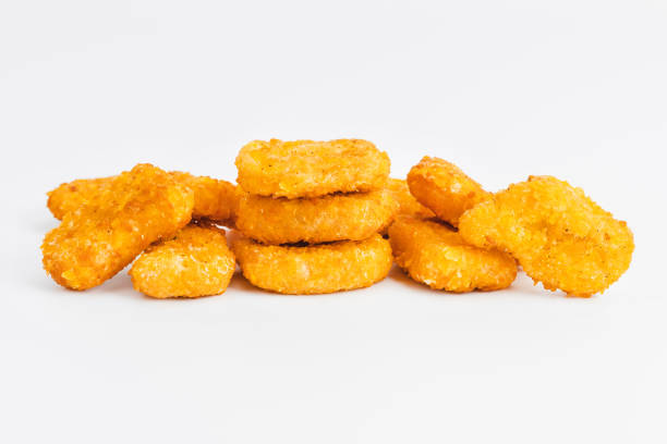 istock Breaded Chicken Inner Fillet on a White Background,Chicken Breaded Raw Meat.Chicken Breaded Fillet. Breaded chicken nuggets. Fast homemade food at home. Chicken breaded schnitzels. Fast cooking. 1767772874