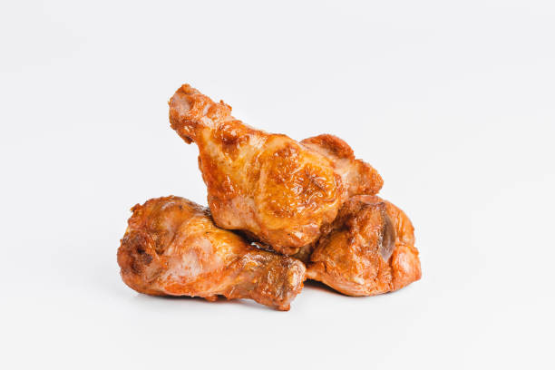 istock Chicken wings fried until half cooked, semi-finished product with fresh herbs on a white background. Fast food. Quick cooking at home. Copy space.Fast cooking.Fast homemade food. 1767773382