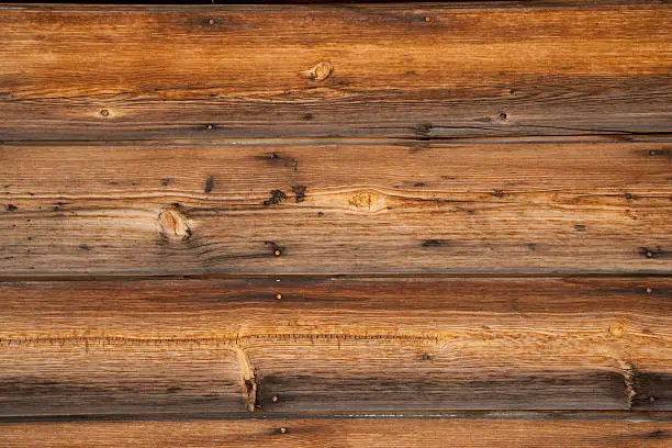 Image is weathered Douglas Fir planks showing detail of grain and nails.