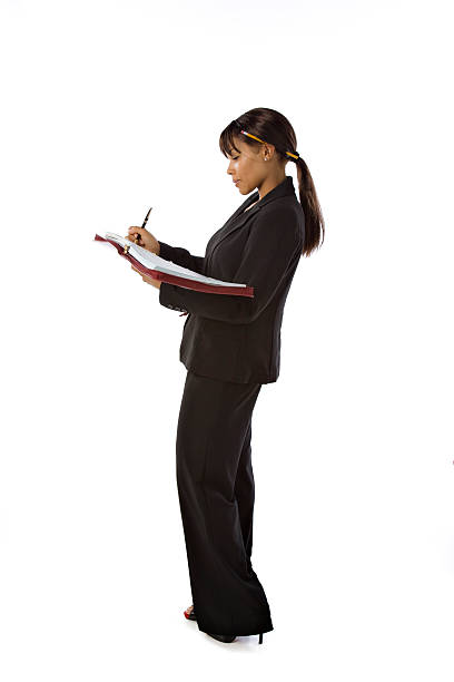 istock Professional Ethnic Businesswoman Writing in Notebook 176778583