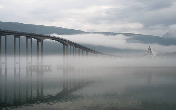 The bridge in a morning fog. stock photo