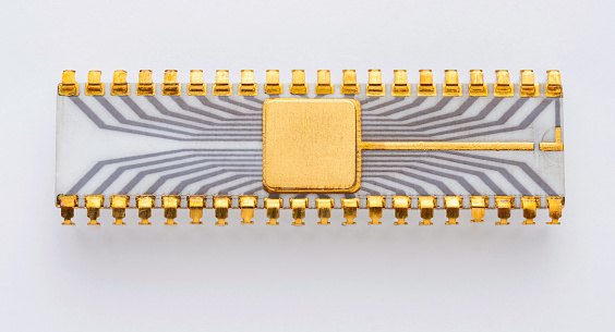 A forty pin vintage computer chip on a white background