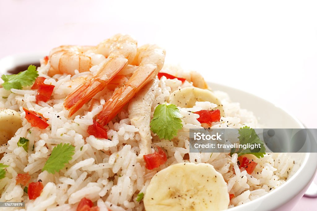 Rice Salad with Prawn or Shrimp and Banana "Rice salad with a mango vinaigrette dressing. Salad includes prawn or shrimp, roast chicken, banana, tomato and coriander. This is also a great way to use leftover turkey!" Banana Stock Photo