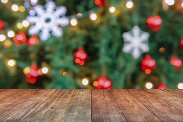 istock Empty wood table top with blur Christmas tree with bokeh light background 1767791209