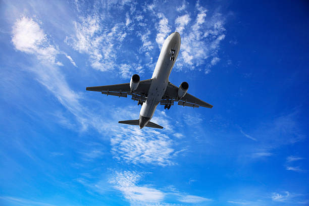 istock Jet Aeroplane Landing From Sunny Blue Sky 176779374