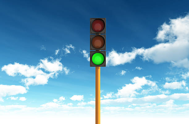 Green Traffic Light against Blue Sky Backgrounds Another image in my portfolio green light stoplight photos stock pictures, royalty-free photos & images