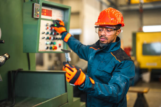 istock Black Male Factory Worker Checking Product Quality 1767801156