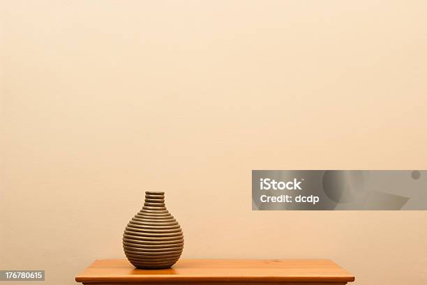 Short Striped Vase On Small Table Stock Photo - Download Image Now - Arrangement, Art, Arts Culture and Entertainment