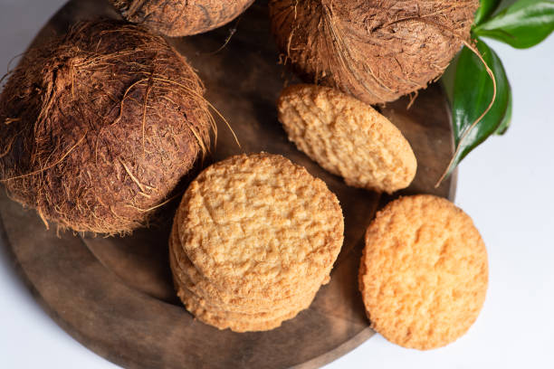 Cinnamon and coconut cookies on white background