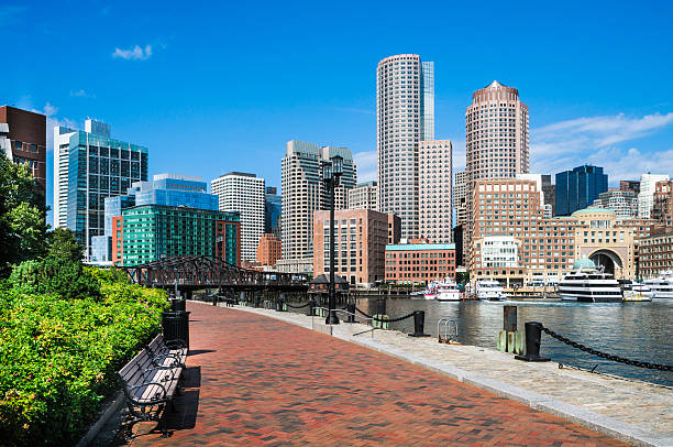 Harborwalk Benches An ample supply of benches along the length of Boston's Harborwalk invite city explorers to stop and enjoy the vistas of this beautiful city. harborwalk stock pictures, royalty-free photos & images