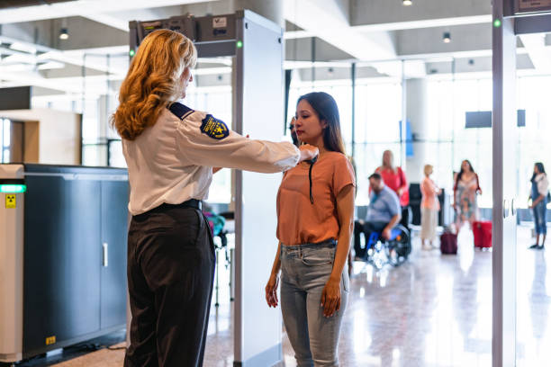 istock Airport Security Screening: Friendly Staff Ensuring Safety 1767844475