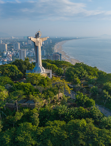 Aerial photo of Tao Phung mountain and statue of Christ standing with arms outstretched, Vung Tau city, Ba Ria Vung Tau province