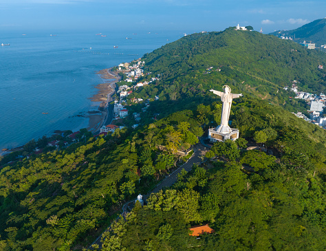 Aerial photo of Tao Phung mountain and statue of Christ standing with arms outstretched, Vung Tau city, Ba Ria Vung Tau province