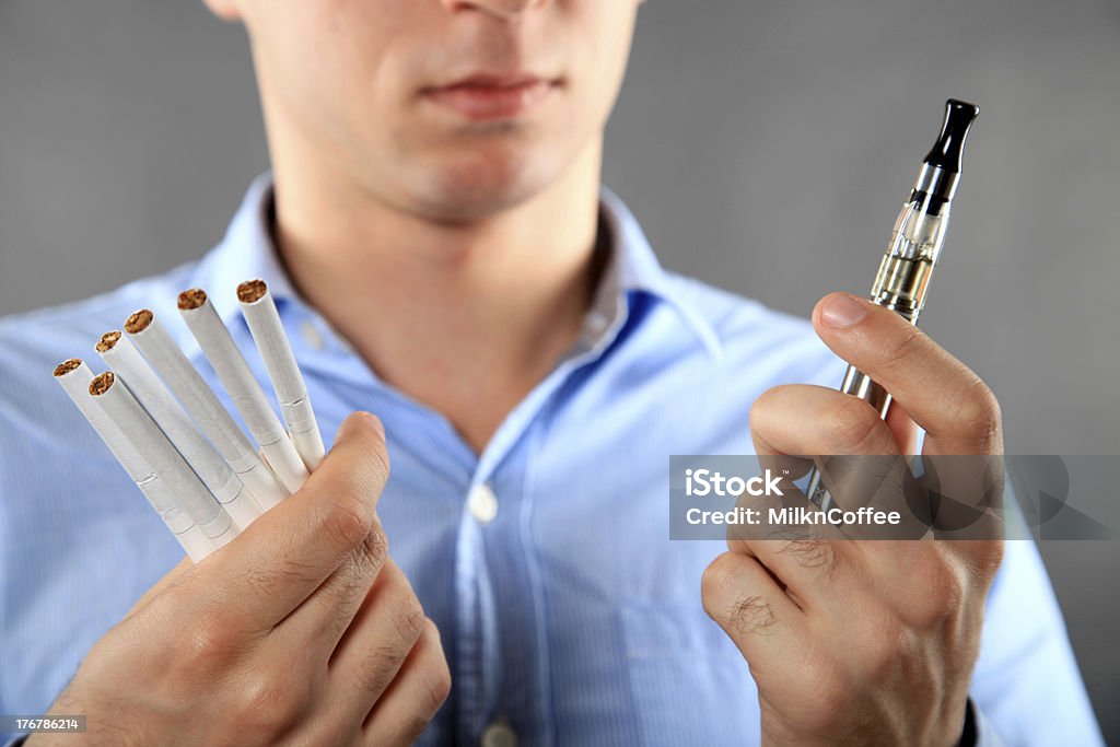 Choice between cigarette and e-cigarette Battery Stock Photo