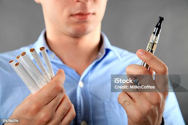 Choice Between Cigarette And Ecigarette Stock Photo - Download Image Now - Battery, Button Down Shirt, Choice