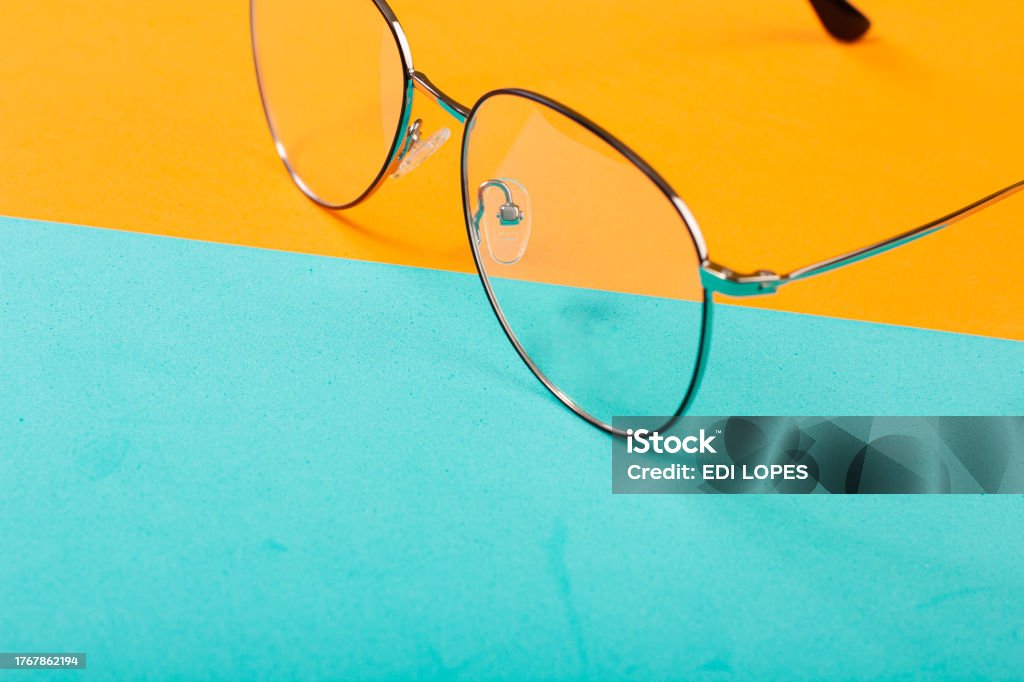 EYEGLASSES STUDIO Prescription glasses on colorful background with modern and stylish frame in studio photo with copy space Beach Stock Photo