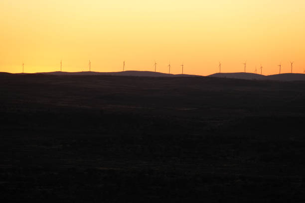 Wind turbines viewed at dusk on the Barrier ranges in Broken Hill, New South Wales.